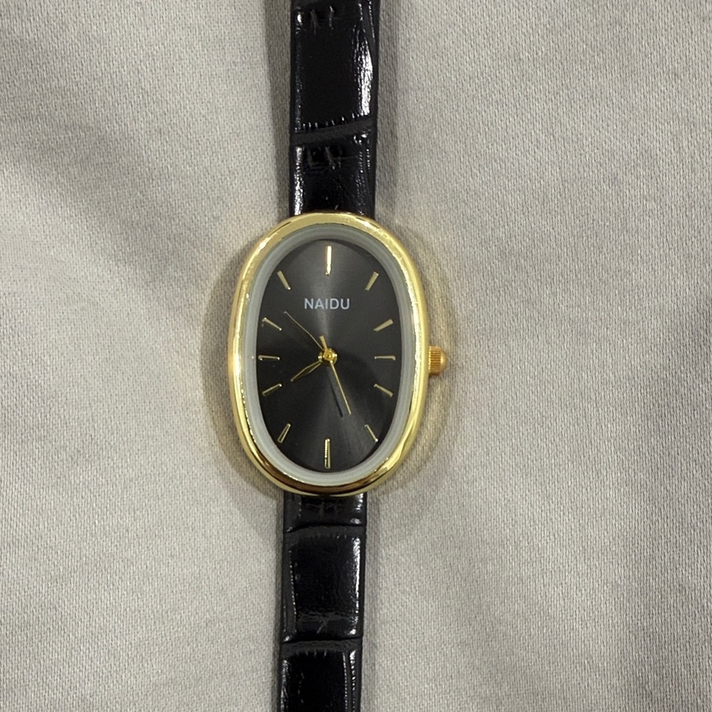 Naidu- vintage style ! Black and Gold Oval Watch